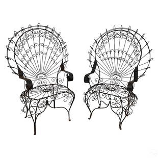 Salterini Style Twisted Iron Throne Peacock Chairs: A pair of twisted wrought iron fan back peacock chairs, produced circa early 20th Century in the style of designer John Salterini (1887-1952). Generously proportioned high backed throne chairs with de