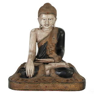 Tibetan Life Sized Wooden Buddha Temple Sculpture: An artisan carved life sized Chinese Tibetan style wood temple statue. A figural work depicting Gautama Buddha seated in lotus and mudra pose, hand carved with realistic details and embellished with c