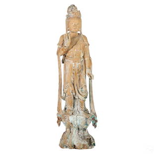 Chinese Carved Wood Figural Guanyin Buddha Statue: A Chinese artisan carved wood temple sculpture. A figural work depicting Guanyin or similar bodhisattva figure, hand carved with realistic details and depicted on a lotus base. Hand decorated in color