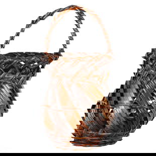 Japanese Full Belly Bamboo Twig Handle Basket: An antique Japanese bamboo floral or ikebana basket. Features wide and narrow woven bamboo, with a natural twig wrapped into the woven handle. No apparent makers mark. Dimensions: 18 X 9 X 9 in. Condi