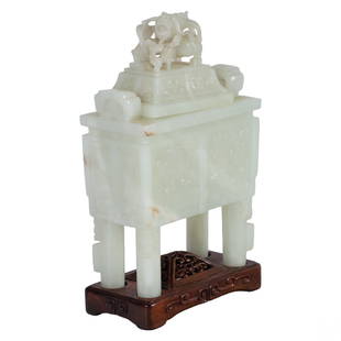 Chinese White Jade Dragon Censer Incense Burner: A Chinese jade incense censer. A rectangular carved white jade body with relief designs to side panels depicting archaic dragons, clouds, fire pearls, and other auspicious symbols. Surmounted by a