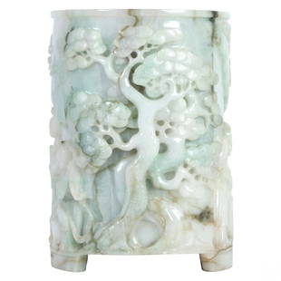 Chinese White Jade Stone Scholars Vessel Brush Pot: A Chinese hard stone scholars brush pot vessel. A figural group in carved white jade with green and amber inclusions, featuring encircling raised relief depictions of Guanyin and Immortal attendant