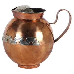 Victoria of Taxco Style Copper and Silver Pitcher: A vintage Mexican modern mixed metal water pitcher vessel produced in the style of Victoria of Taxco (Victoria Ana Nunez de Brilanti) (1910-1999). Crafted from hand hammered copper, and decorative