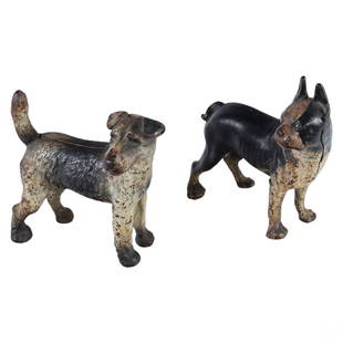 Antique Cast Iron Boston and Terrier Dog Doorstops: An estate lot of two (2) antique cast iron standing dog door stops produced in the style of Hubley Manufacturing Co. (Lancaster, PA). Includes an iconic Boston Terrier and or bulldog, and a Jack Russe