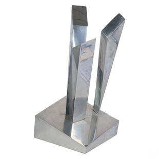 Modern Abstract Chromed Aluminum Metal Sculpture: A polished aluminum sculpture. A modern work featuring an integration of assembled three geometric rhomboid slats fitted in a rhomboid form base with slanted angles and sides. No apparent signature. P