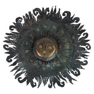 Mid Century Artisan Copper and Iron Sunburst Face: Brutalist wall hanging sunburst. Features raised copper in the center with iron sun rays, and modeled with a curious expression. Sunburst are constructed of hand hammered iron. No apparent makers mark