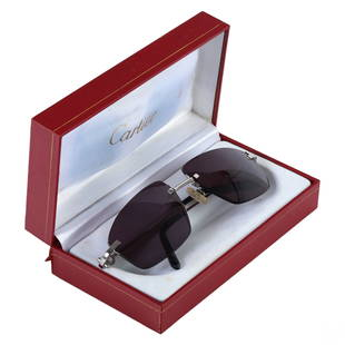 Cartier Mens Designer Frames Eyeglasses Sunglasses: A pair of Cartier (Paris) French designer mens sunglass frames eyewear with prescription lenses. Rimless metal with chromatic finish, and squared dark gray lenses. Temples marked 138 280089 and CARTIE