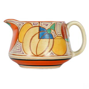 Clarice Cliff Fantasque Art Pottery Melon Picher: A vintage English art pottery pitcher with handle, by Clarice Cliff (1899-1972). From the colorful Fantasque melon pattern collection. Features an orange, blue, brown and yellow geometric art deco des