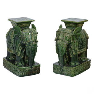 Chinese Mid Century Modern Elephant Garden Stools: A pair of Chinese Mid Century Modern art pottery garden stools. Green glazed terracotta bodies produced circa 1970s in the forms of elephant pachyderms with howdah seats on back. No apparent maker mar