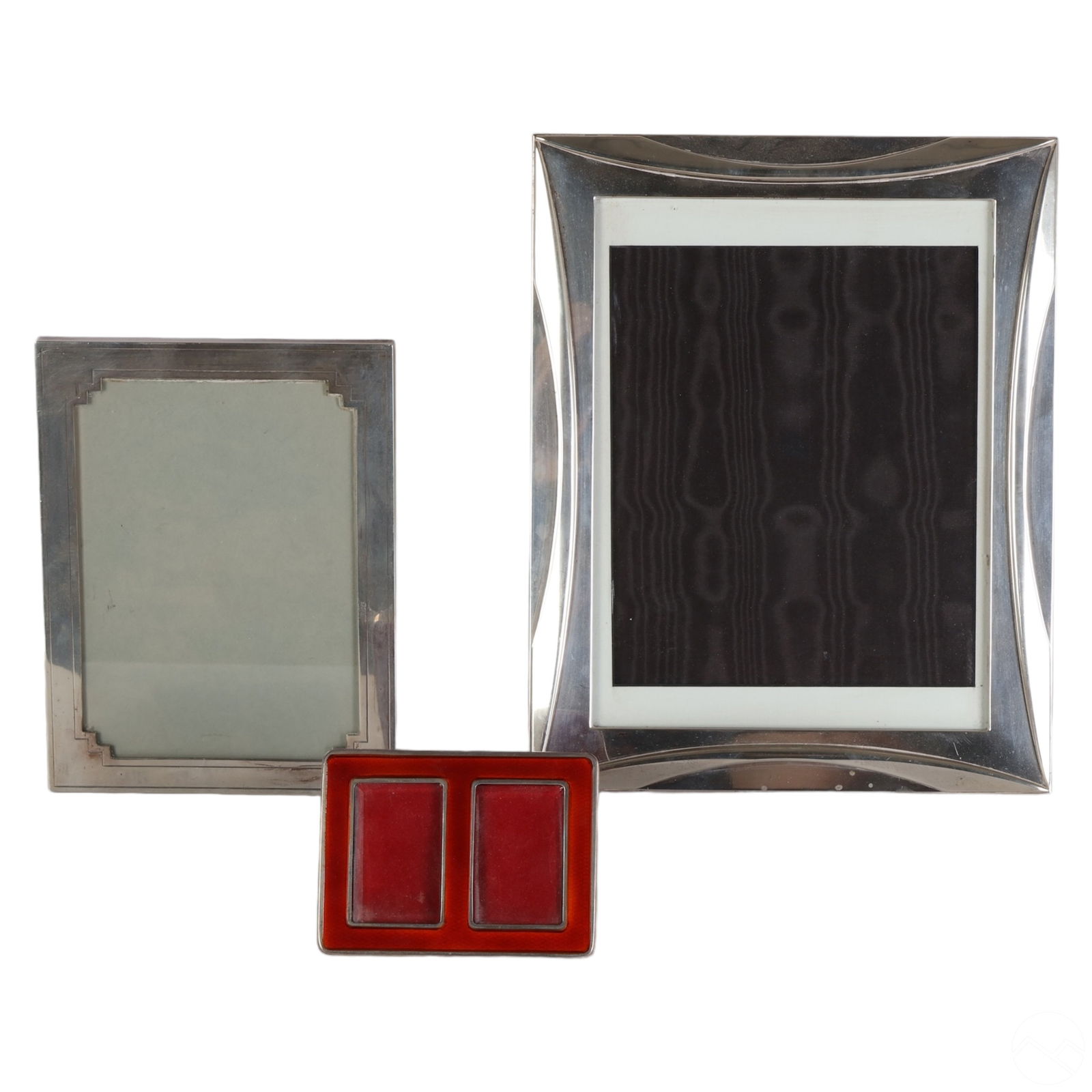 Cartier Sterling Silver Photograph Frames 3pc. LOT: An estate lot featuring three (3) Cartier designer sterling silver photograph picture frames with easel backs. Includes: one (1) large Cartier sterling silver picture frame with a classic modernist de