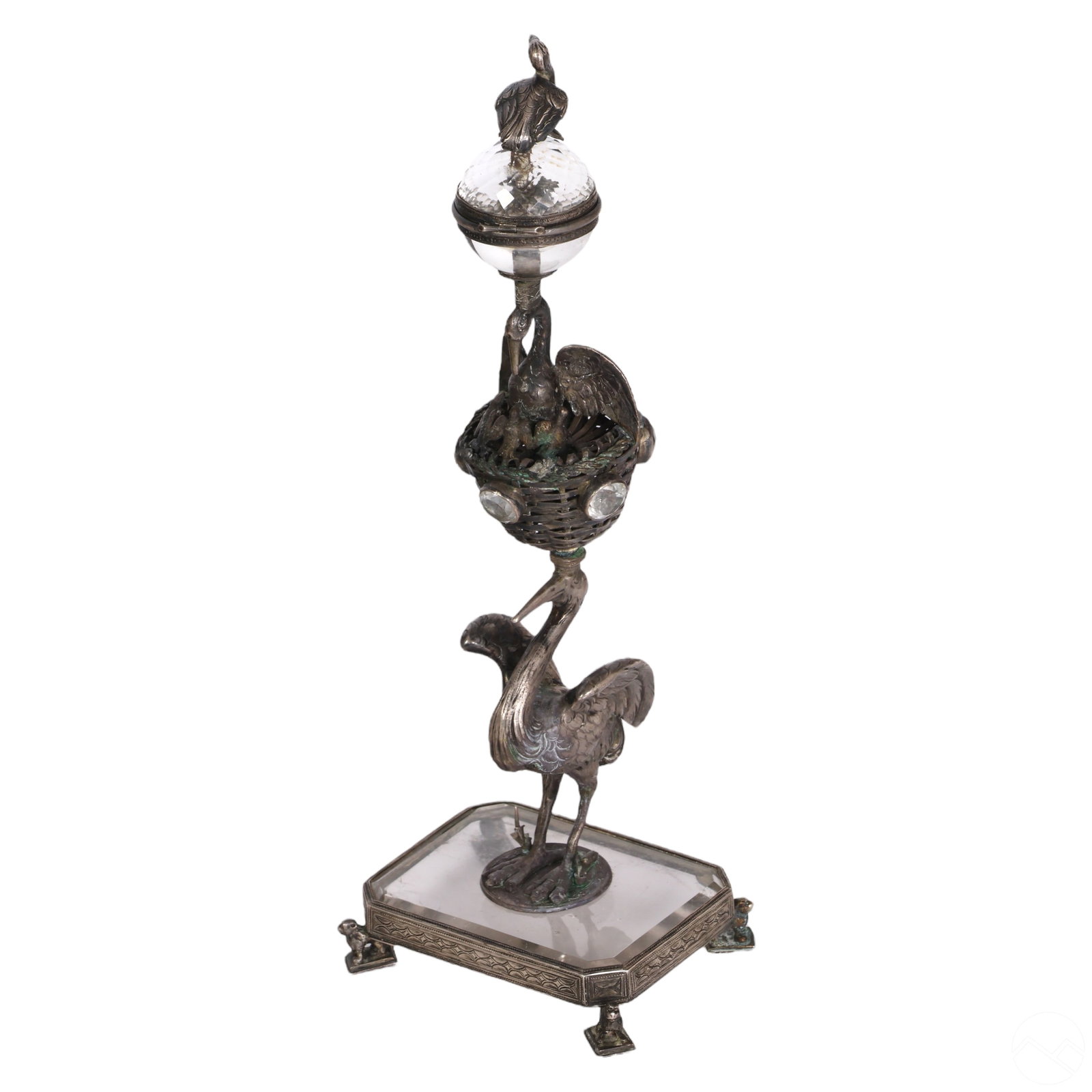 Judaica Crystal & Silver Figural Birds Spice Tower: An antique silver and crystal Judaica besamim spice tower. Features a figural stork or crane bird atop a woven basket form, supported by a nested bird with a trio of chicks, supporting a faceted hinge