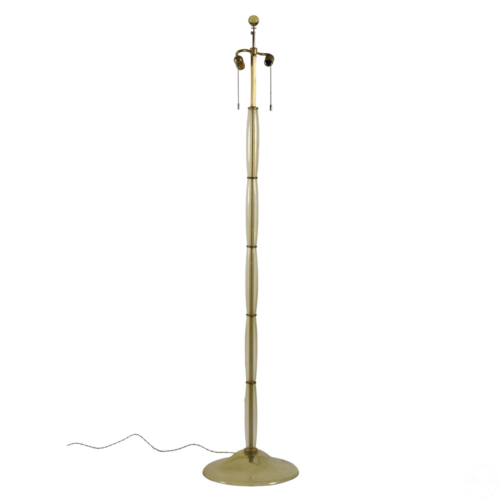 Donghia Gigante Designer Murano Glass Floor Lamp: A vintage Donghia Gigante glass floor lamp designed by Angelo Donghia (1935-1985). It features a series of slender, hand-blown Murano Fieno glass sections with brass hardware, a round glass base, doub