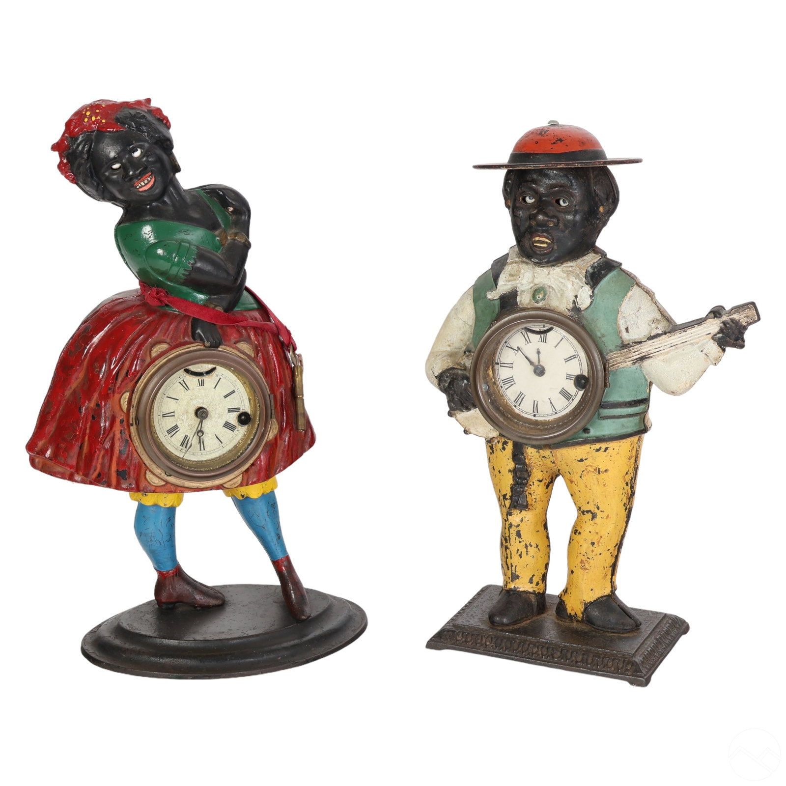 Antique Black Americana Cast Iron Blinking Clocks: An estate lot featuring two (2) antique cast iron historic Black Americana clocks, circa the late 19th century, styled after Waterbury Clock Co. and Bradley & Hubbard Manufacturing. The lot includes: 