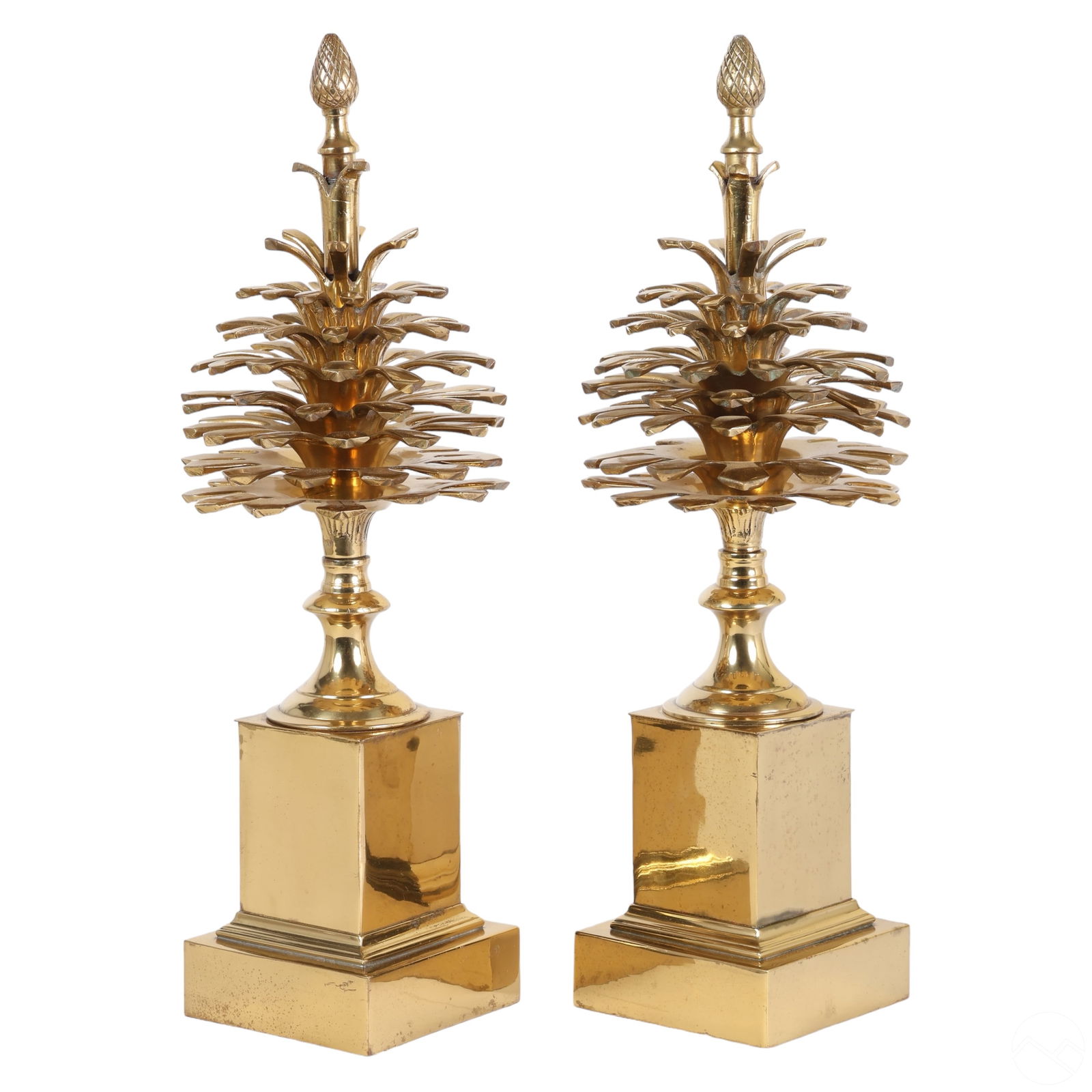 Maison Charles Style Pr. Pomme de Pins Garnitures: Vintage brass pair of Pomme de Pin pinecone garnitures attributed to Maison Charles (Paris). These iconic postmodern designs feature central brass pinecones surmounted by elegant stems with complement