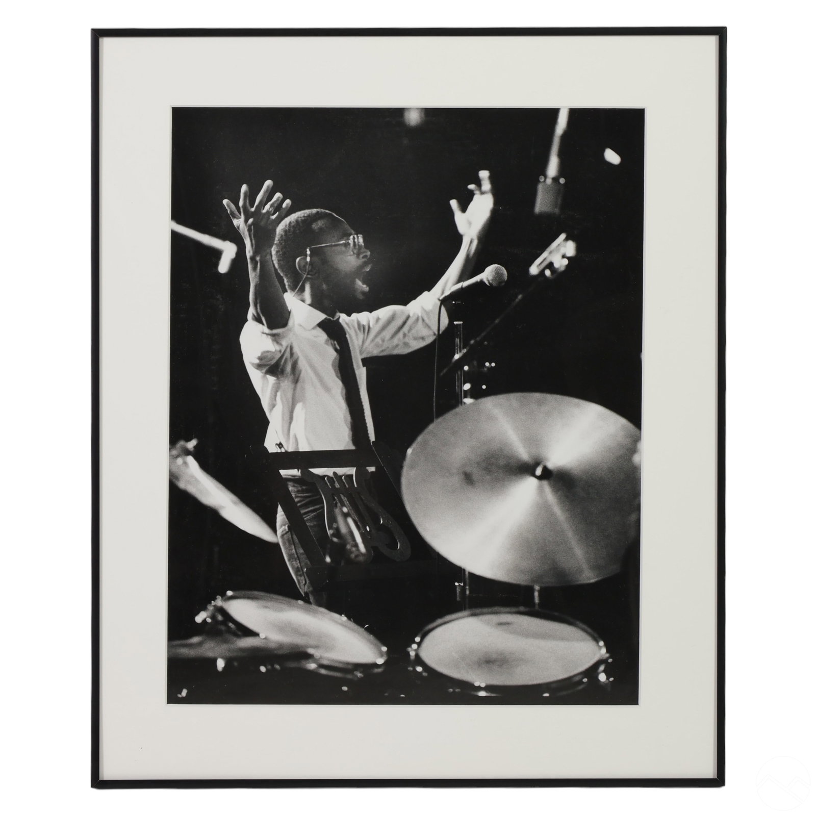 Jerry Stoll 1923-2004 African American Jazz Photo: Jerry Stoll (American, 1923-2004). A black and white photograph of an African American jazz musician playing drums. The musician is captured in a dynamic moment, passionately playing the drums with hi