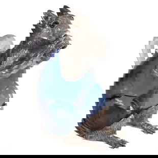 Silver Plate and Blue Art Glass Squirrel Decanter: A playful silverplate and cobalt blue art glass figural squirrel decanter, featuring detailed silver-plated mounts and expressive glass eyes. The body of the decanter is shaped in a seated squirrel