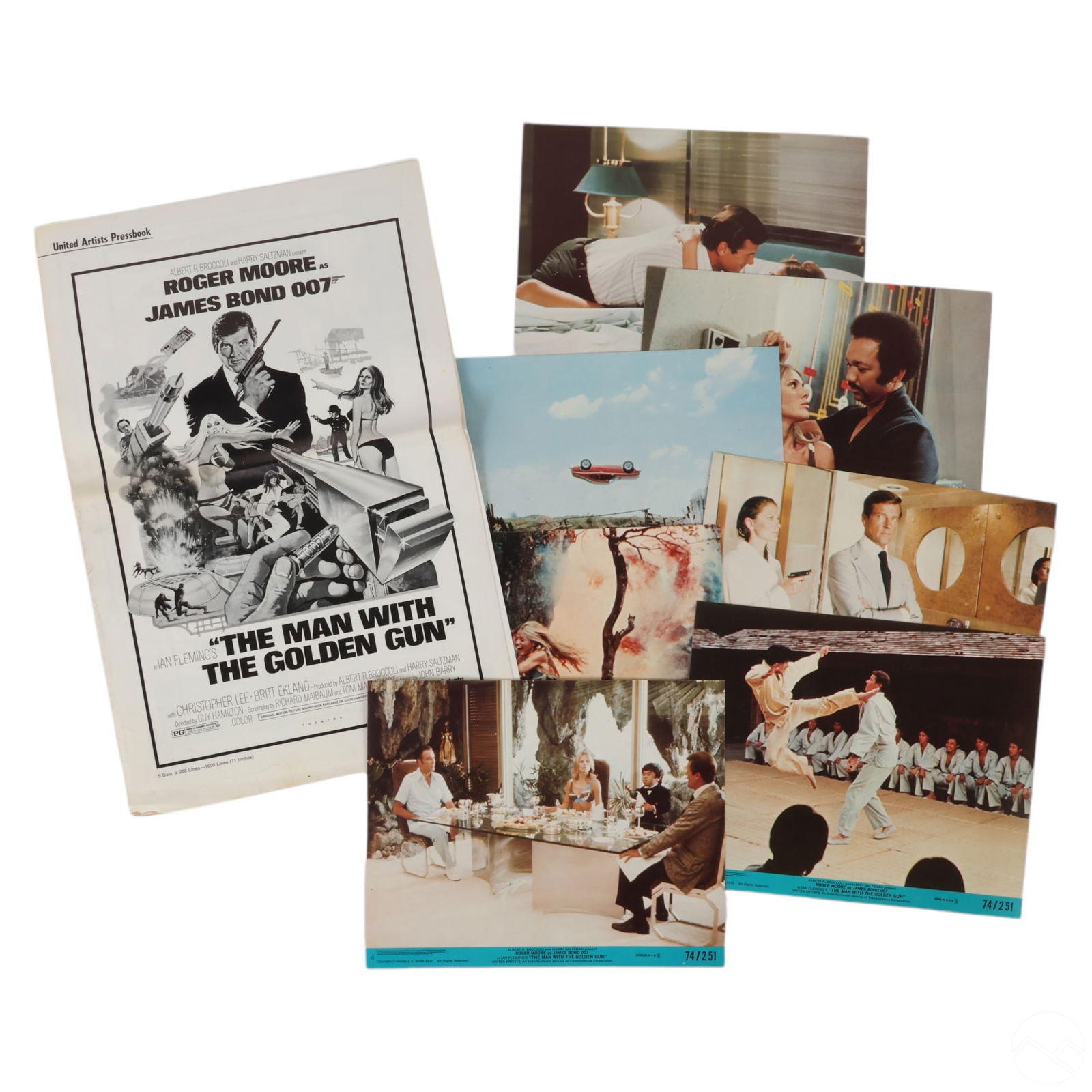 James Bond Man With The Golden Gun Pressbook Cards: A collection of promotional materials for the 1974 James Bond film The Man with the Golden Gun, starring Roger Moore as 007. The set includes a pressbook on the left, featuring stylized artwork with M