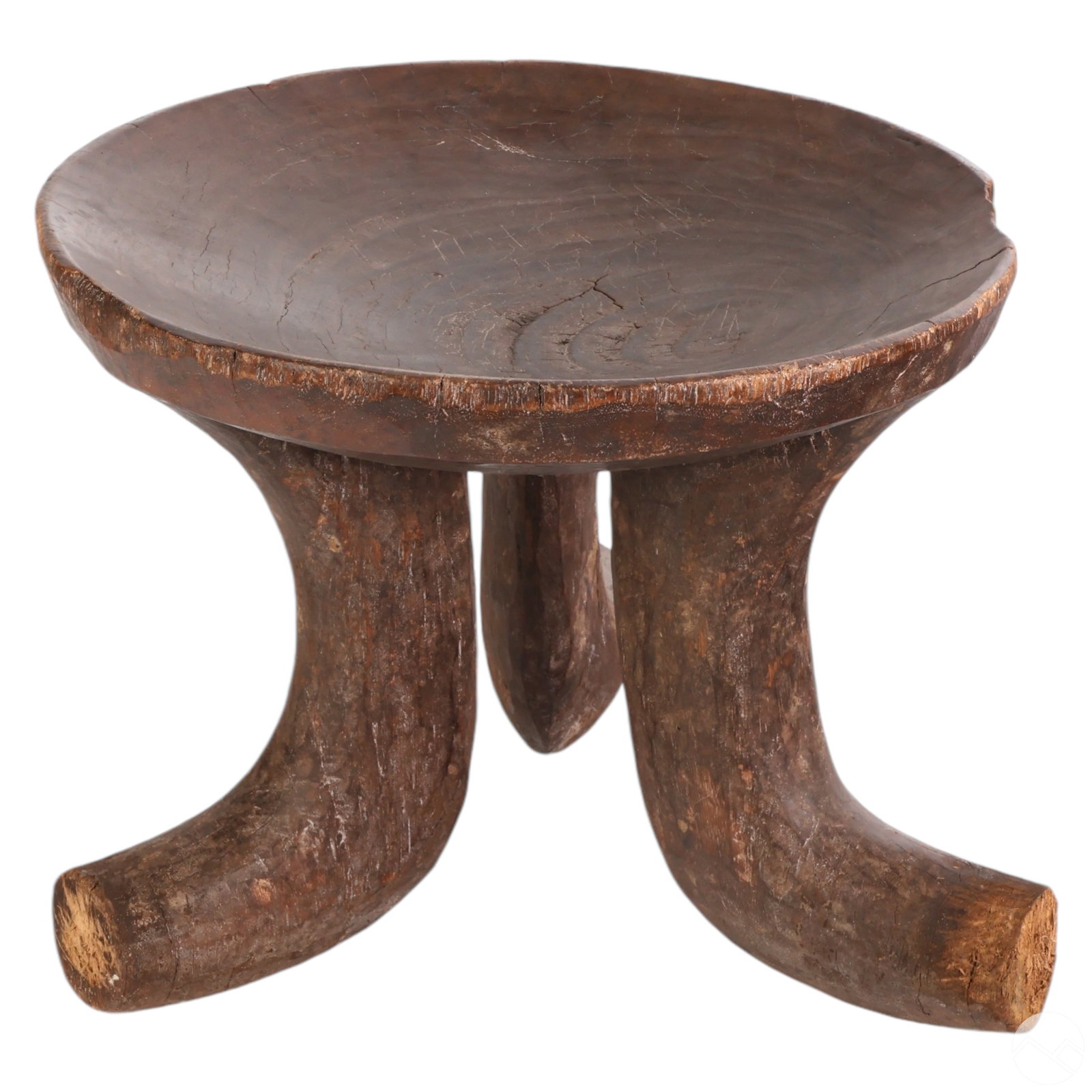 Ethiopian Wood Carved 20th Century Tribal Stool: Ethiopian wood carved tribal stool, originally designed for tribal seating and crafted for the export trade. Created by the Gurage Peoples, this stool features a well-patinated wooden seat supported b