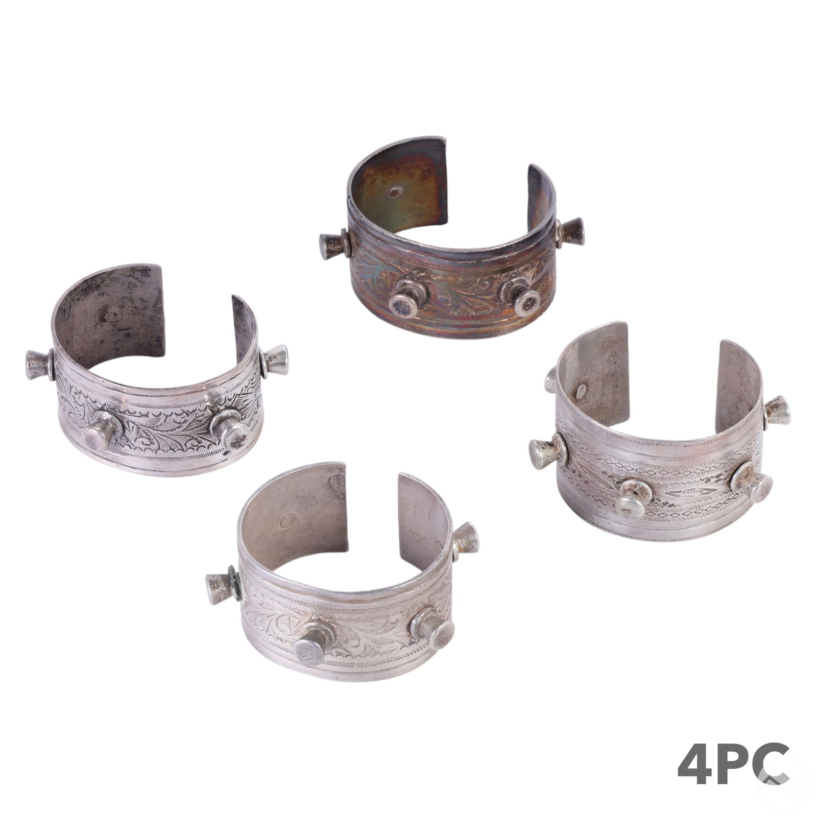 Moroccan Berber Silver Cuff Bangle Bracelet 4p LOT: Estate lot of four wide cuff bracelets in the Moroccan Berber style, featuring traditional Middle Eastern tribal designs. These handcrafted silver cuffs are adorned with intricate engraved patterns an