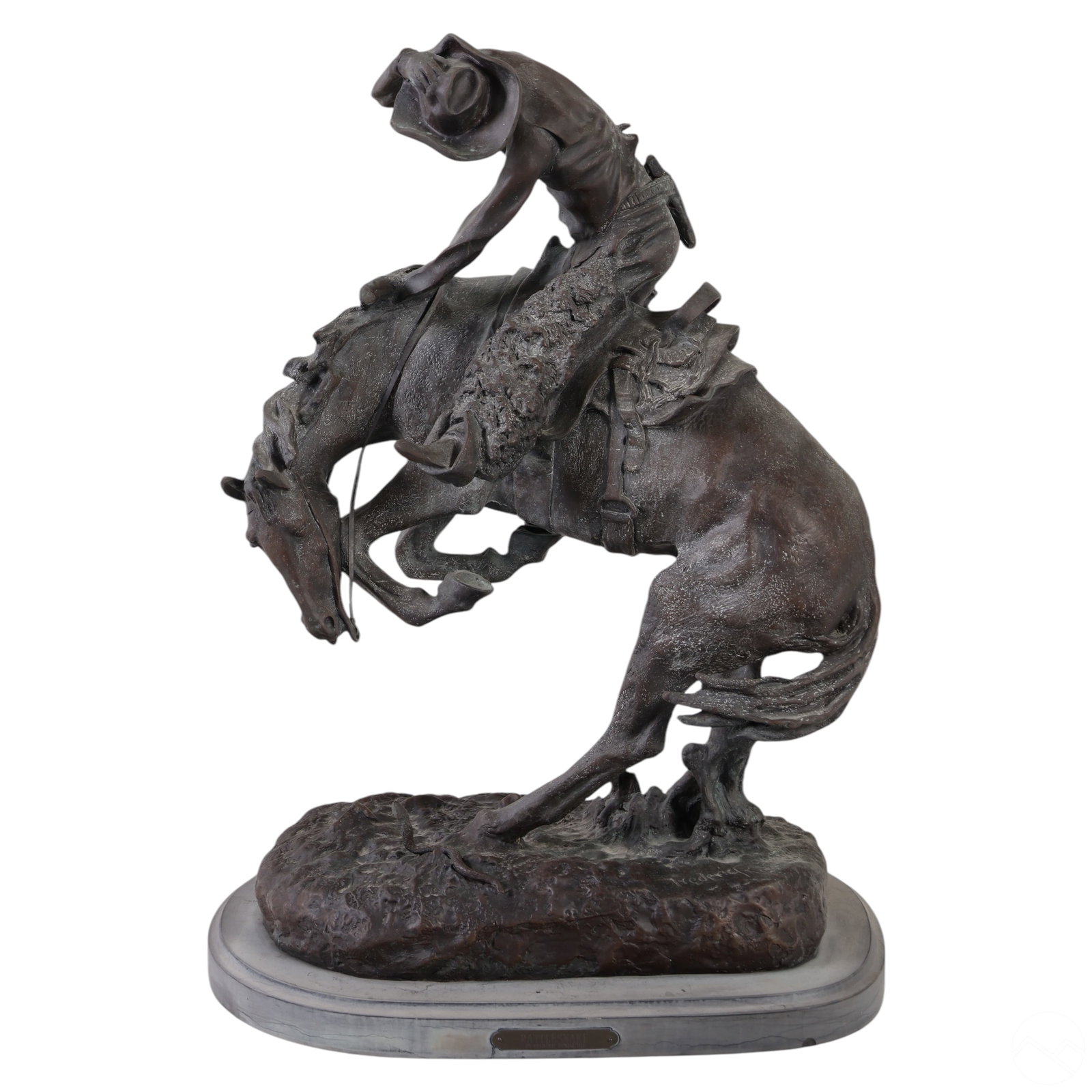 Rattlesnake Horse Bronze Sculpture after Remington: Bronze sculpture titled Rattlesnake, after Frederic Remington (American, 1869-1909). The composition depicts a rugged Western cowboy on horseback, gripping the horse's mane with his left hand and hold