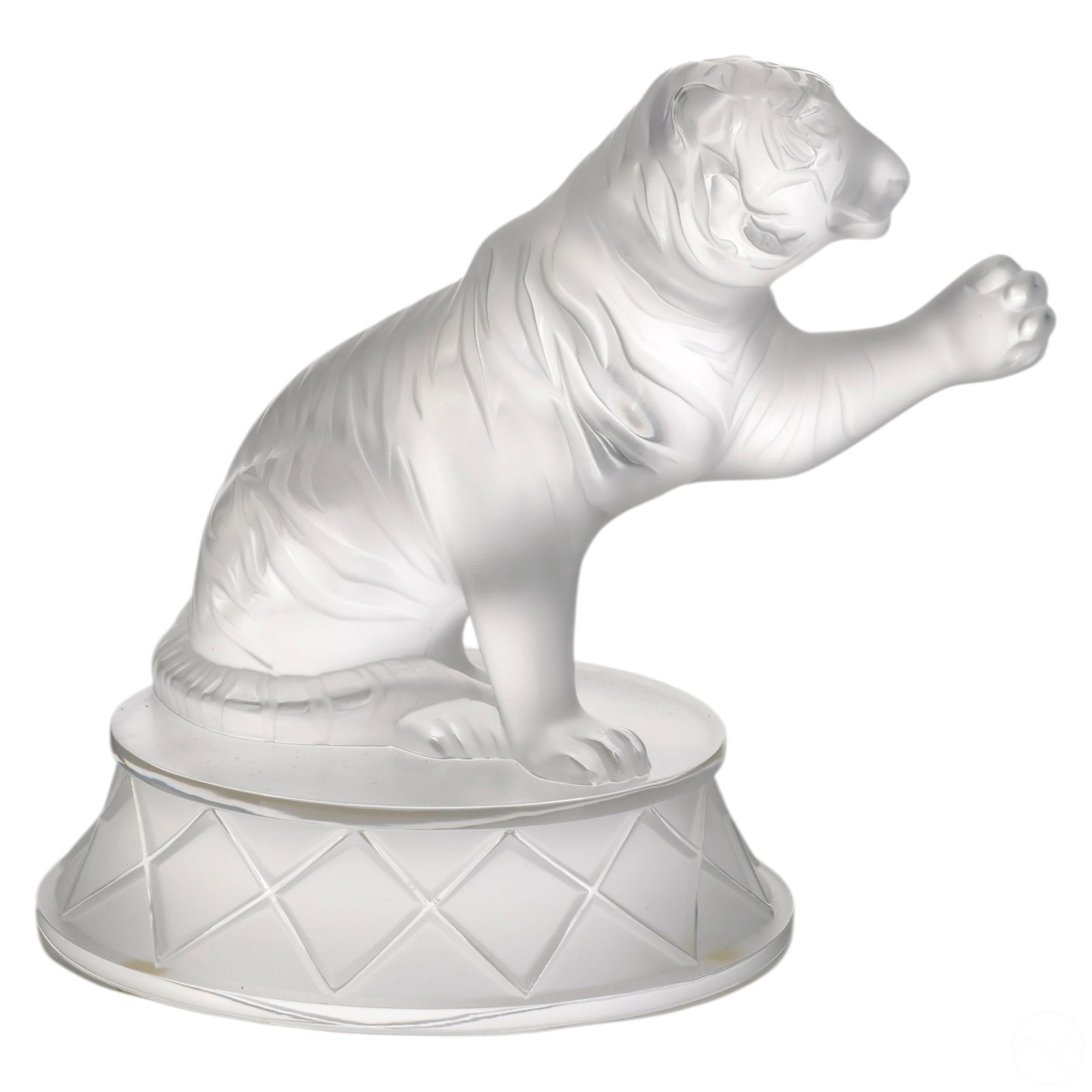 Lalique French Crystal Circus Tiger Tigrou Figure: Lalique France frosted crystal figurine depicting a circus tiger seated on a round plinth base with one paw raised. Executed in frosted and polished crystal with stylized detailing to the figure and b