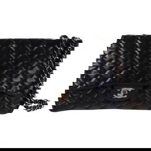 Chanel Black Quilted Leather Double Flap Bag Purse: Chanel classic double flap shoulder bag in black lambskin leather with iconic diamond quilting and silver-tone hardware. Features the signature interlocking CC turn-lock clasp and a woven leather and