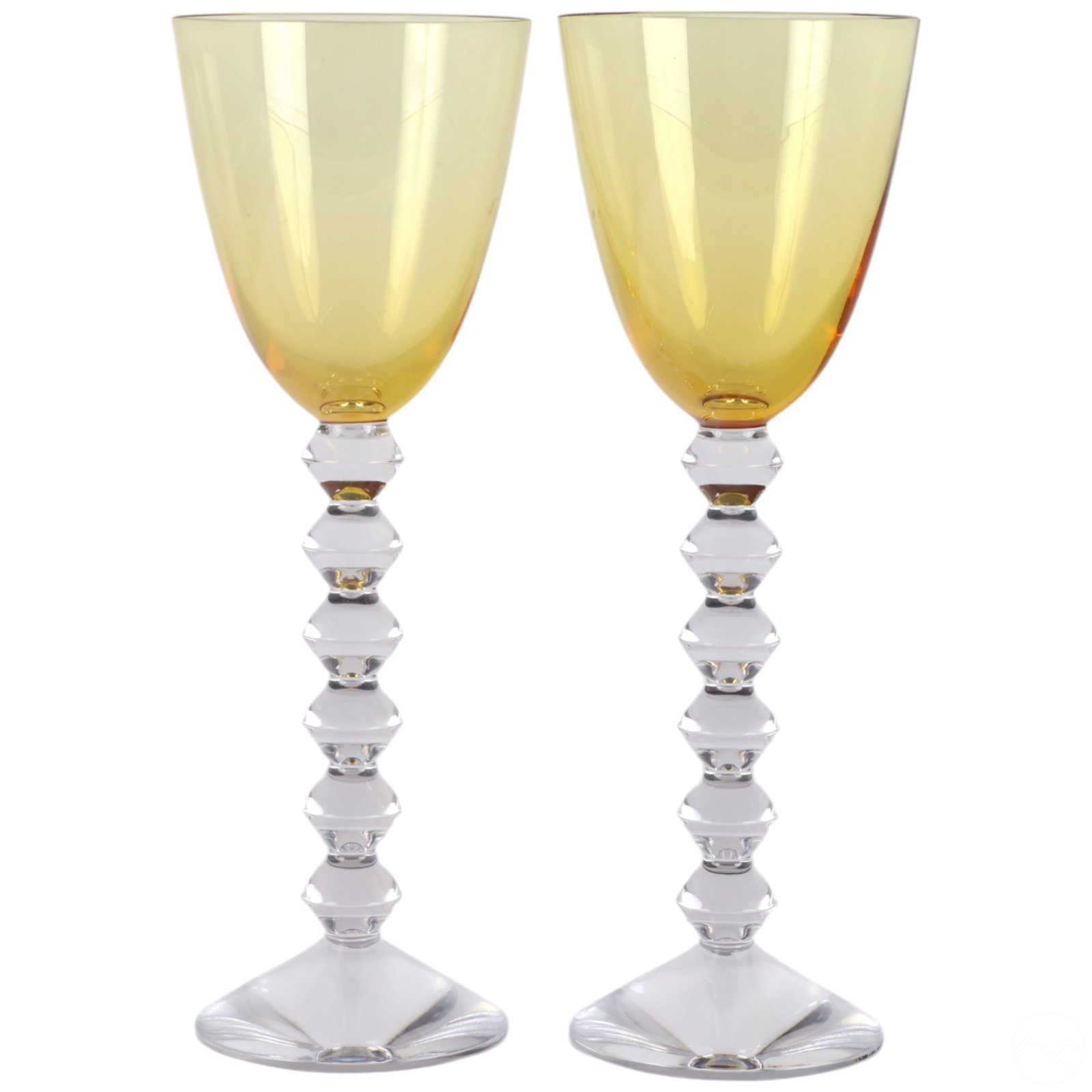 Baccarat French Crystal Topaz Rhine Wine Glasses: Pair of Baccarat Topaz crystal Rhine wine glasses, featuring rich golden-yellow bowls with smooth tapering sides above elegant, stacked clear crystal knop stems. The design emphasizes the striking con