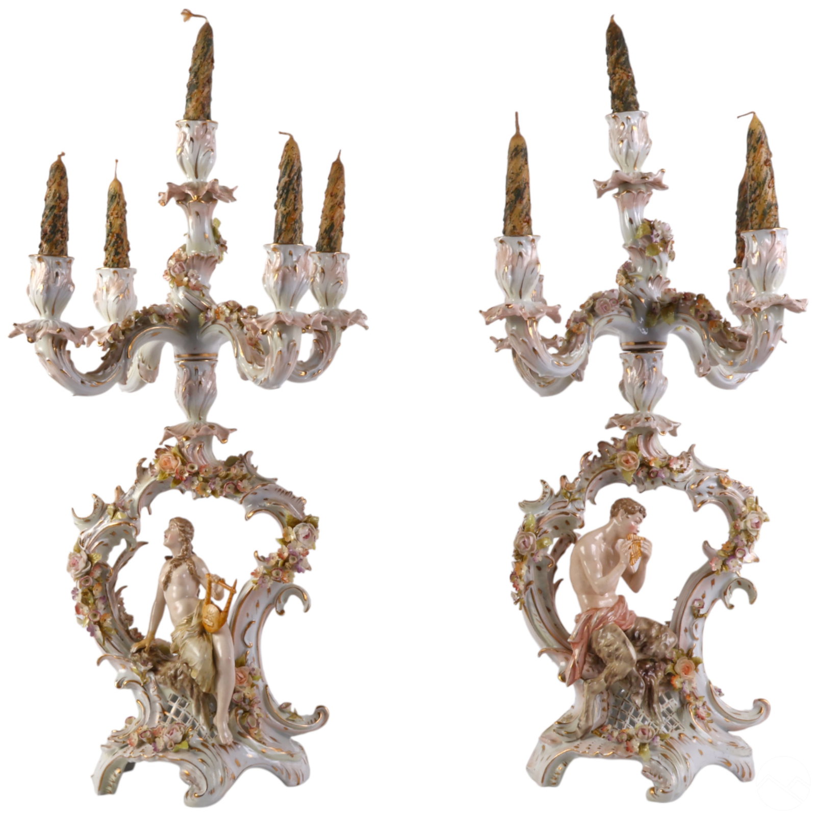 Pair of 19C German Porcelain Figural Candelabras: Pair of antique German porcelain five-light candelabras in the Rococo Revival style, each featuring finely modeled mythological and allegorical figures. One depicts a seated nude male with a pan flute