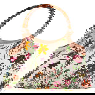 Gucci Vintage Bamboo Handle Flora Canvas Tote Bag: Gucci structured floral canvas handbag tote featuring the iconic multicolor Flora print with flowers, insects, and butterflies, trimmed in natural Vachetta leather with polished bamboo handles. Includ