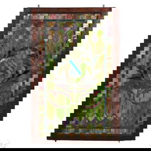 Antique Foliate Ribbon Crest Stained Glass Window: Antique architectural salvaged vertical leaded and stained glass window panel in a dark wood frame, featuring a central laurel wreath with a red ribbon framing a blue diamond-form jewel. Bordered by a