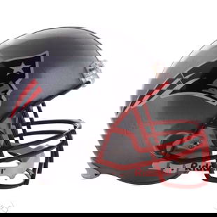 NFL New England Patriots Super Bowl Helmet SIGNED: NFL New England Patriots full-size metallic silver Riddell helmet featuring team logos on both sides and a red facemask. Autographed by multiple players from a Super Bowl roster in black and blue mark