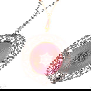 Edwardian Platinum Diamond Enamel Watch Necklace: Antique Edwardian platinum and gold diamond pink guilloche enamel pendant watch necklace. The circular watch is crafted in platinum and gold within an openwork platinum filigree bezel with leaf motifs