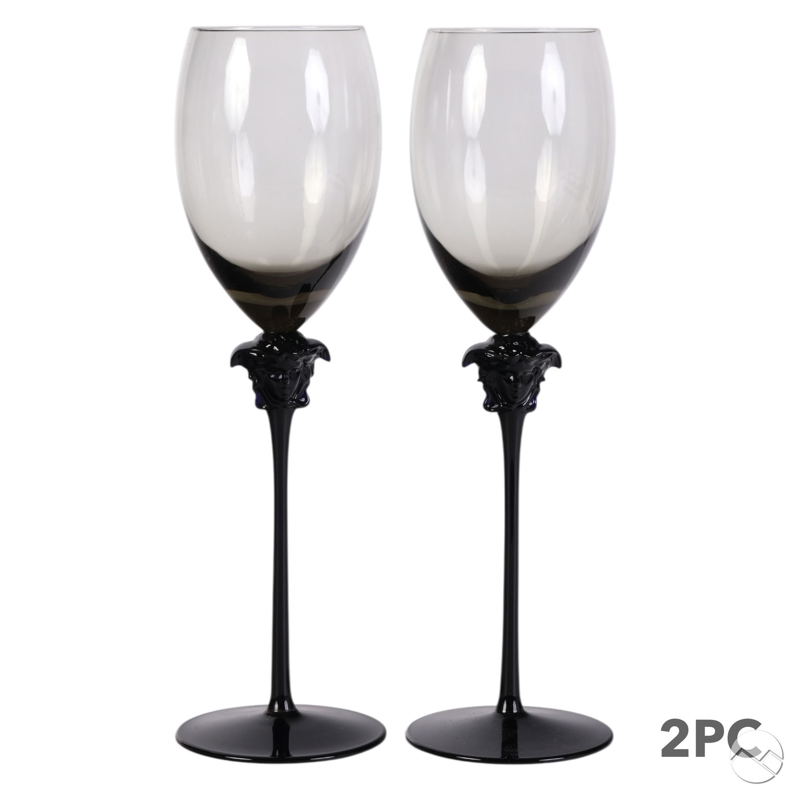 Versace Rosenthal Medusa Lumiere Haze Wine Goblets: Pair of Rosenthal Versace barware white wine glass goblets in the Medusa Lumiere Haze pattern, introduced in 2016. Each features a smoke-tinted bowl with a glossy black stem and base, adorned with a s