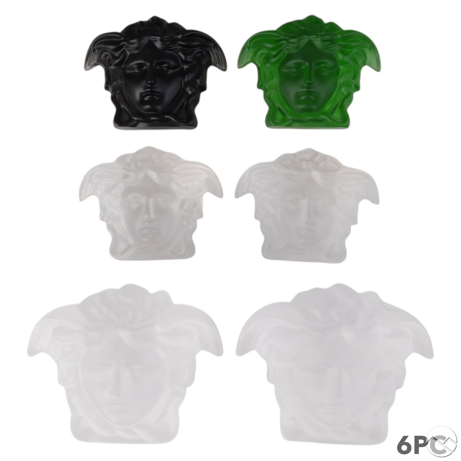 Versace Rosenthal Medusa Head Crystal Sculptures: Rosenthal Versace grouping of six Medusa head figural sculptures in frosted and colored crystal. Includes four frosted Medusa heads in two sizes, one opaque black crystal version, and one translucent