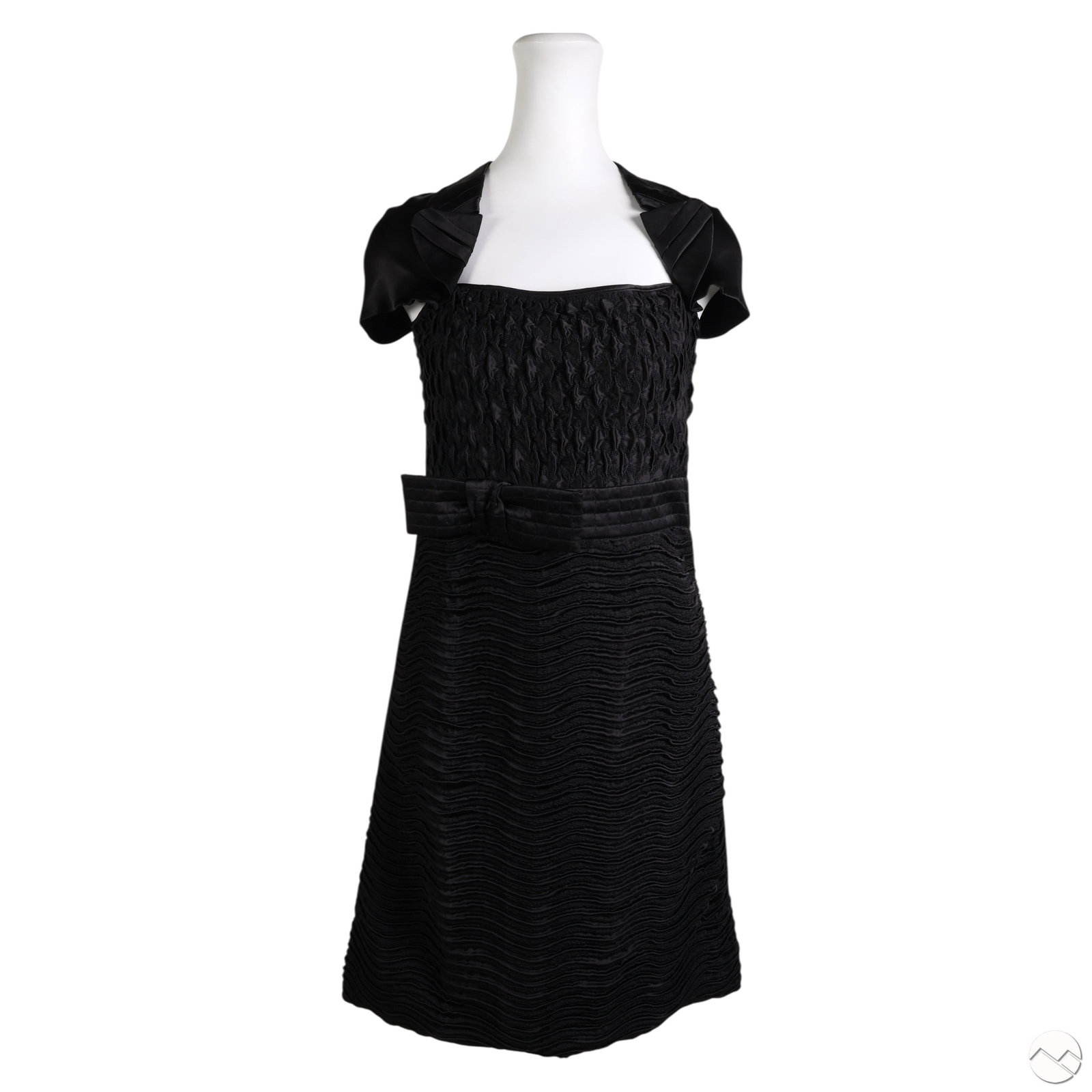 Prada Black Sculpted Silk Cap Sleeve Dress Size 40: Prada black cocktail dress made from 100% silk with sculptural detailing. The bodice is ruched and gathered above a grosgrain ribbon waistband with a bow accent. The skirt features alternating velvet-