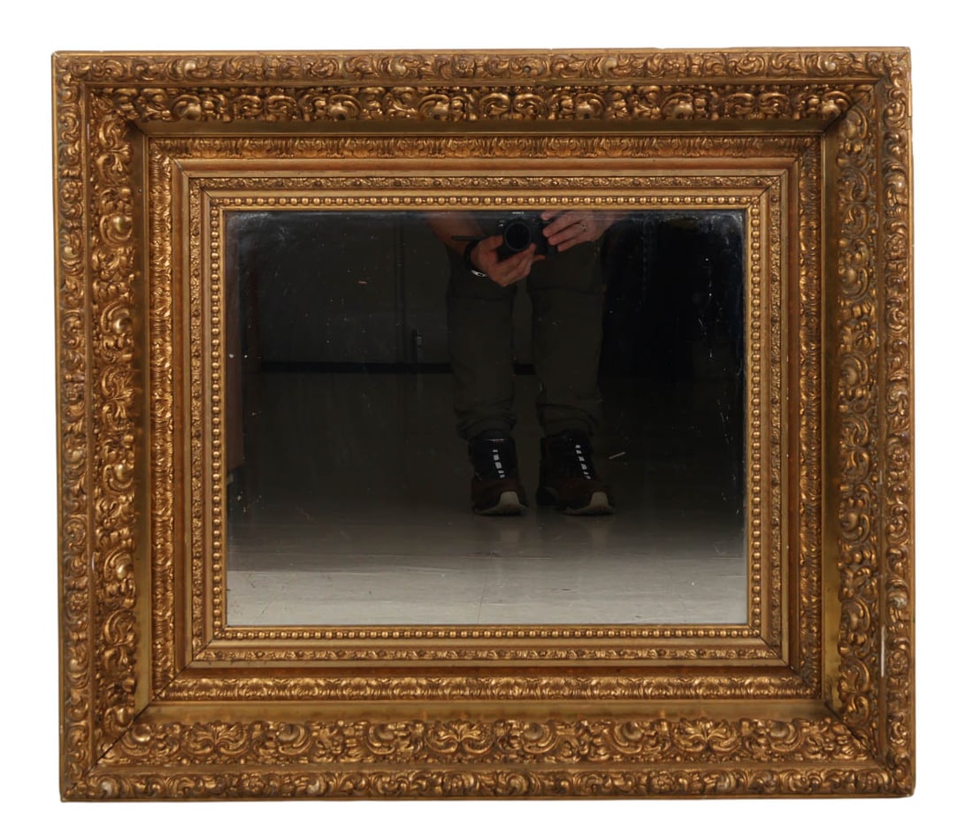 Antique Giltwood & Gesso Wall Mirror Scroll Frame: Antique giltwood and gesso framed wall mirror. The frame features a deep profile with raised ornamental foliate scrolls, acanthus leaves, and a beaded inner molding. No apparent maker's mark.Work Size
