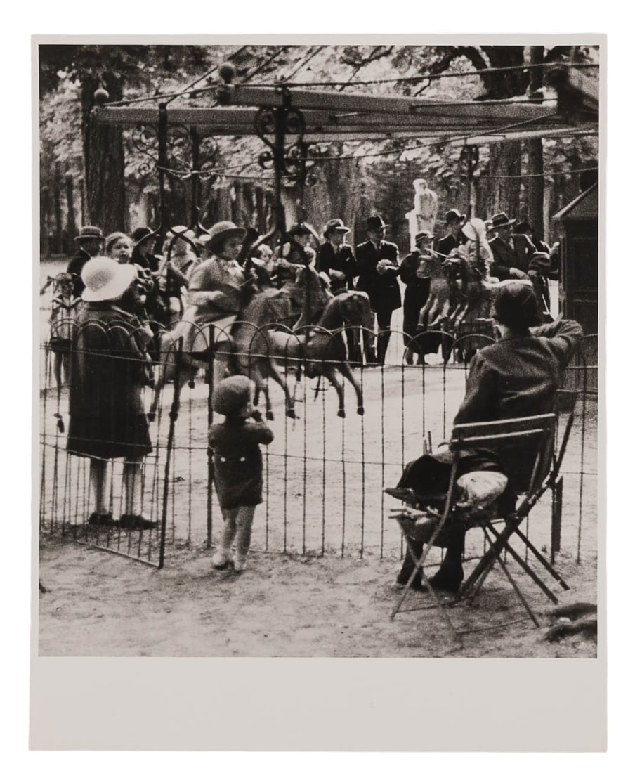 Andre Kertesz 1894-1985 Carousel B & W Photograph: Andre Kertesz (Hungarian-American, 1894-1985), "Groupe denfants, Versailles (Carousel)," circa 1928. Vintage gelatin silver print depicting a group of children at a carousel in Versailles. The print m