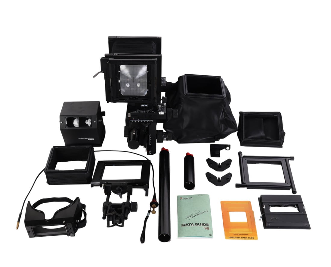 Sinar P2 Monorail View Camera w/ Accessories Case: Sinar, Swiss made P2 monorail large format view camera housed in a fitted hard case with custom foam lining. The camera is equipped with standard bellows, a Sinar binocular reflex magnifier, and a gro