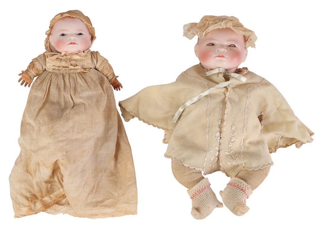 Grace Putname Bisque Bye Lo Baby Dolls Swivel Neck: Pair of early 20th century Bye Lo Baby dolls with swivel necks by Grace Storey Putnam. One with sleep eyes and one with fixed painted eyes. Both have painted bisque heads with blushed cheeks, closed m