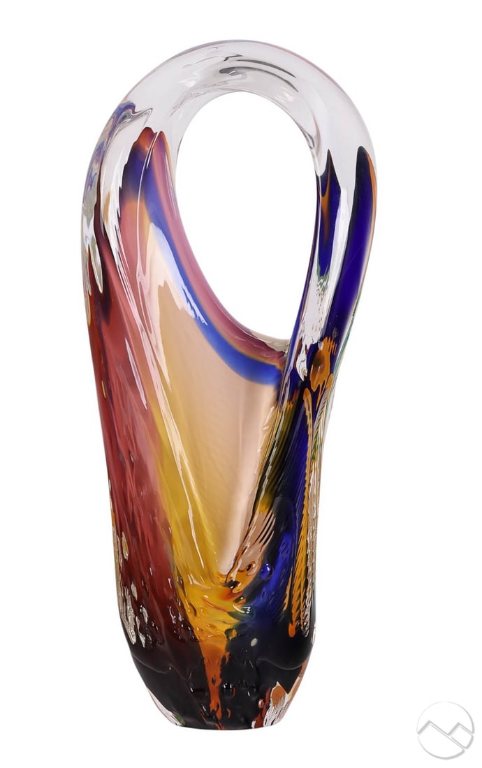 Toby McGee 20C Modern Studio Art Glass Sculpture: Toby McGee (American, 20th century), hand-blown studio glass sculpture featuring a tall looping form with internal ribbons of cobalt blue, amber, green, and violet encased in clear glass. Signed on bo