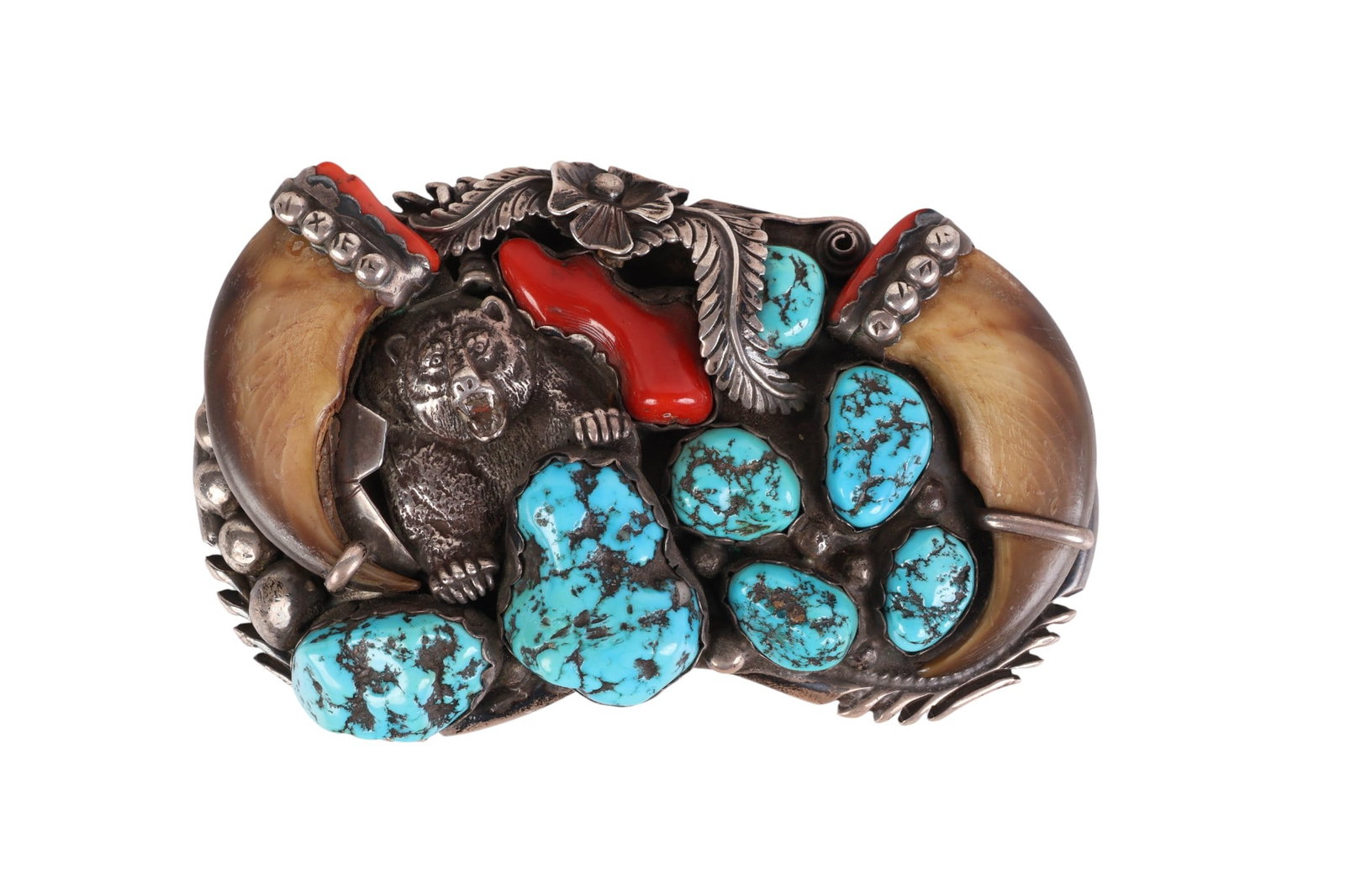 Native American 70s Sterling Claw Turquoise Buckle: Vintage Navajo Native American Indian sterling belt buckle with turquoise nuggets, coral, and bear claws, circa 1970s. The kidney-shaped platform features deeply hand-stamped edges and is adorned with