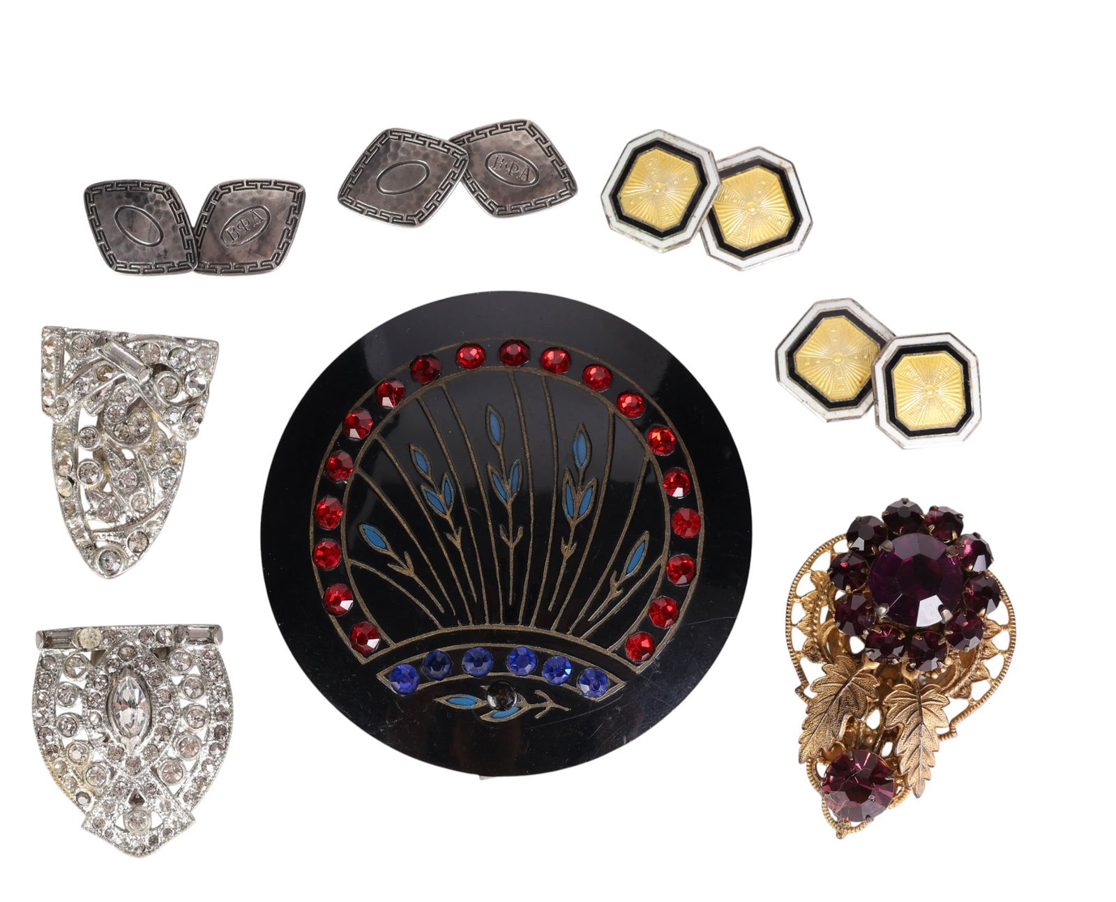 Art Deco 1920s-30s Assortment Cuff Links Clips LOT: Vintage Art Deco assortment of cuff links, dress clips, and a buckle, circa 1920s-1930s. One: silver-plated cuff links with gold guilloche enamel centers bordered by black and white enamel bands; face