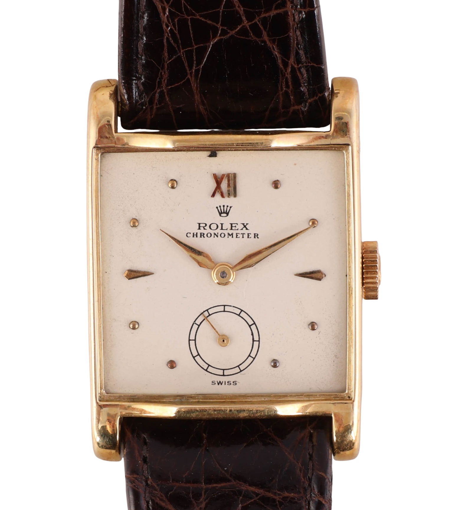 Rolex Vintage 18k Gold Square Dress Wristwatch: Rolex manual wind square dress wristwatch crafted in 18 karat yellow gold. The white dial features applied gold dot and faceted hour indices, gilt dauphine hands, and a recessed subdial at the 6 ocloc