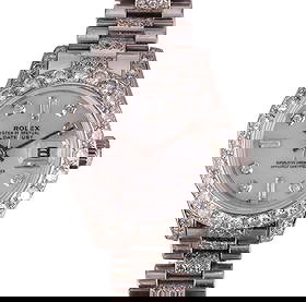 Rolex 18k White Gold Diamond Presidential Watch: Rolex ladies' Presidential model wristwatch crafted in solid 18k white gold. The bezel is set with round brilliant-cut diamonds, while the bracelet is accented with additional small round diamonds. Th