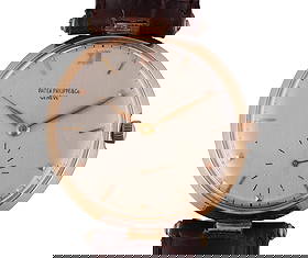 Patek Philippe 18k Gold T-Bar Lugs Wristwatch: Patek Philippe & Co. vintage manual wind wristwatch housed in an 18 karat yellow gold round case featuring distinctive fixed T-bar lugs. The case measures approximately 35mm in diameter (excluding cro