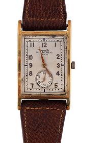 Patek Philippe 18k Gold Rectangular 18j Wristwatch: Patek Philippe & Co. vintage rectangular wristwatch housed in a curved 18 karat yellow gold case with elegant stepped sides. The silver-tone dial is signed Patek Philippe & Co Geneve and features Arab