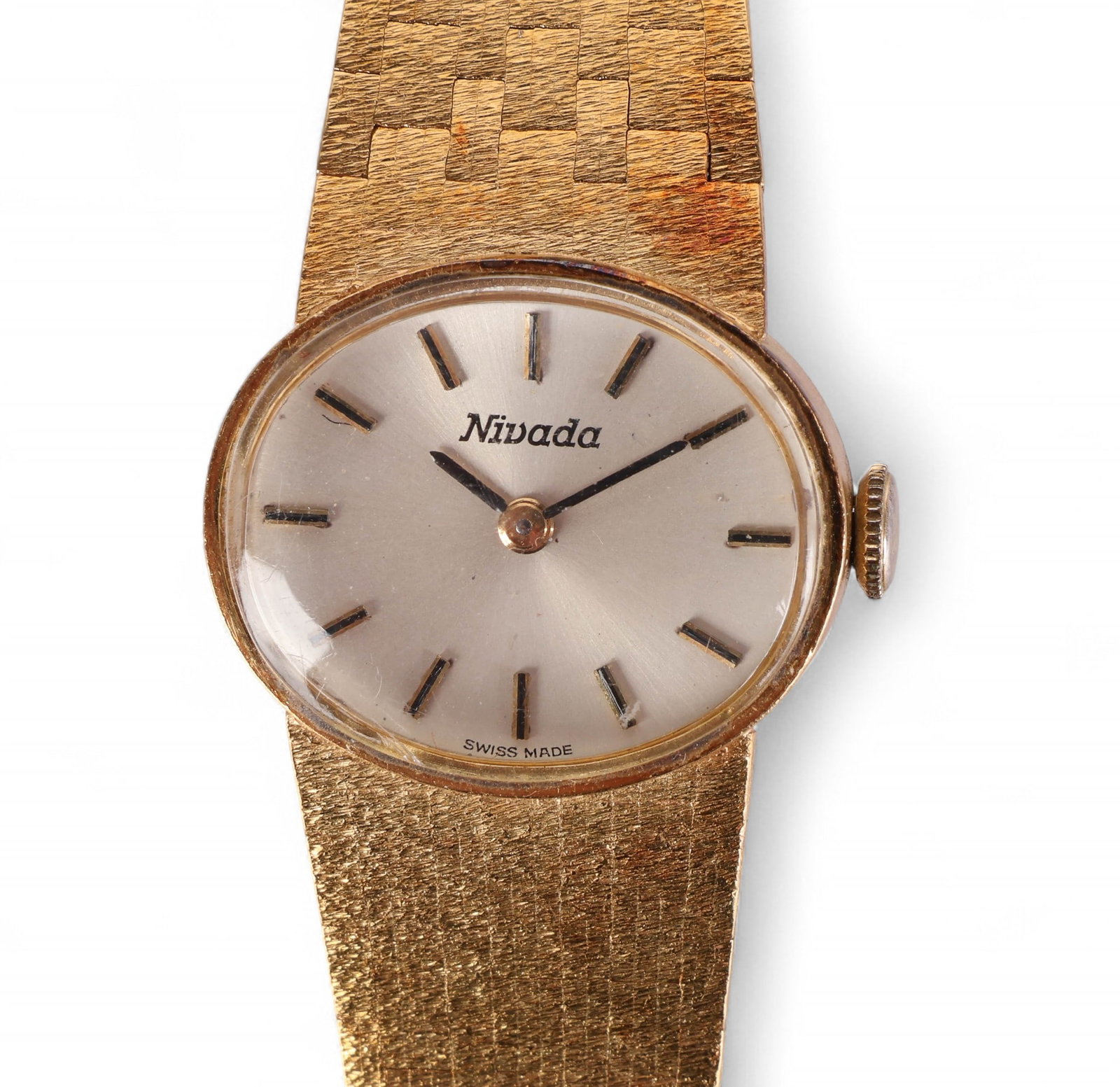 Nivada 18k Yellow Gold Ladies Dress Watch 36.6g: Nivada vintage ladies' wristwatch featuring an elegant integrated bracelet design, entirely crafted in 18k yellow gold. Powered by a 17-jewel manual wind movement, the watch presents a refined silver-