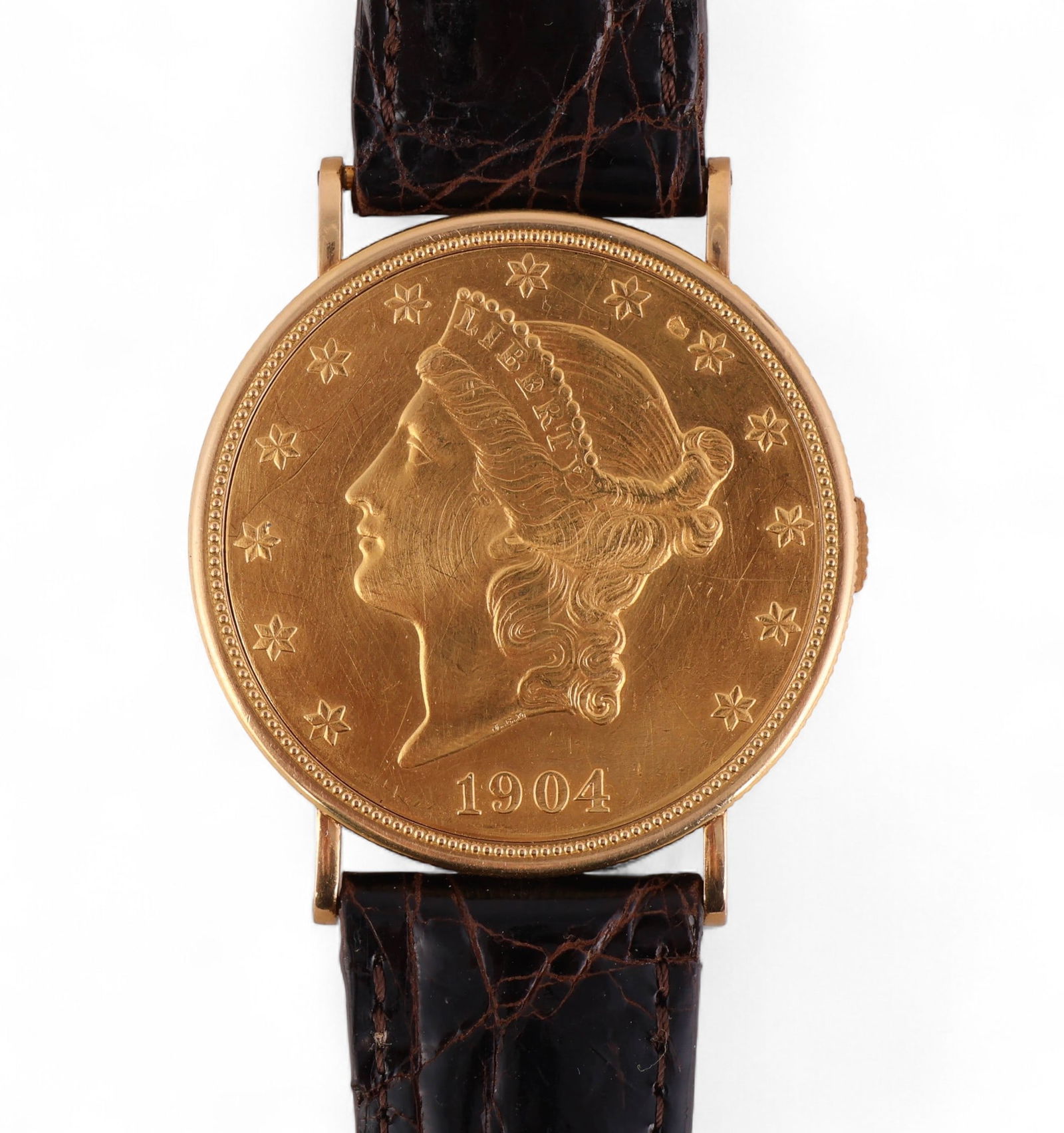 Piaget 1904 $20 Gold Lady Liberty Coin Watch: Hill Auction Gallery Auctionizer said:Piaget $20 Liberty gold coin wristwatch, circa 1970s, featuring a concealed dial housed within an authentic 1904 United States Liberty Head Double Eagle coin. The