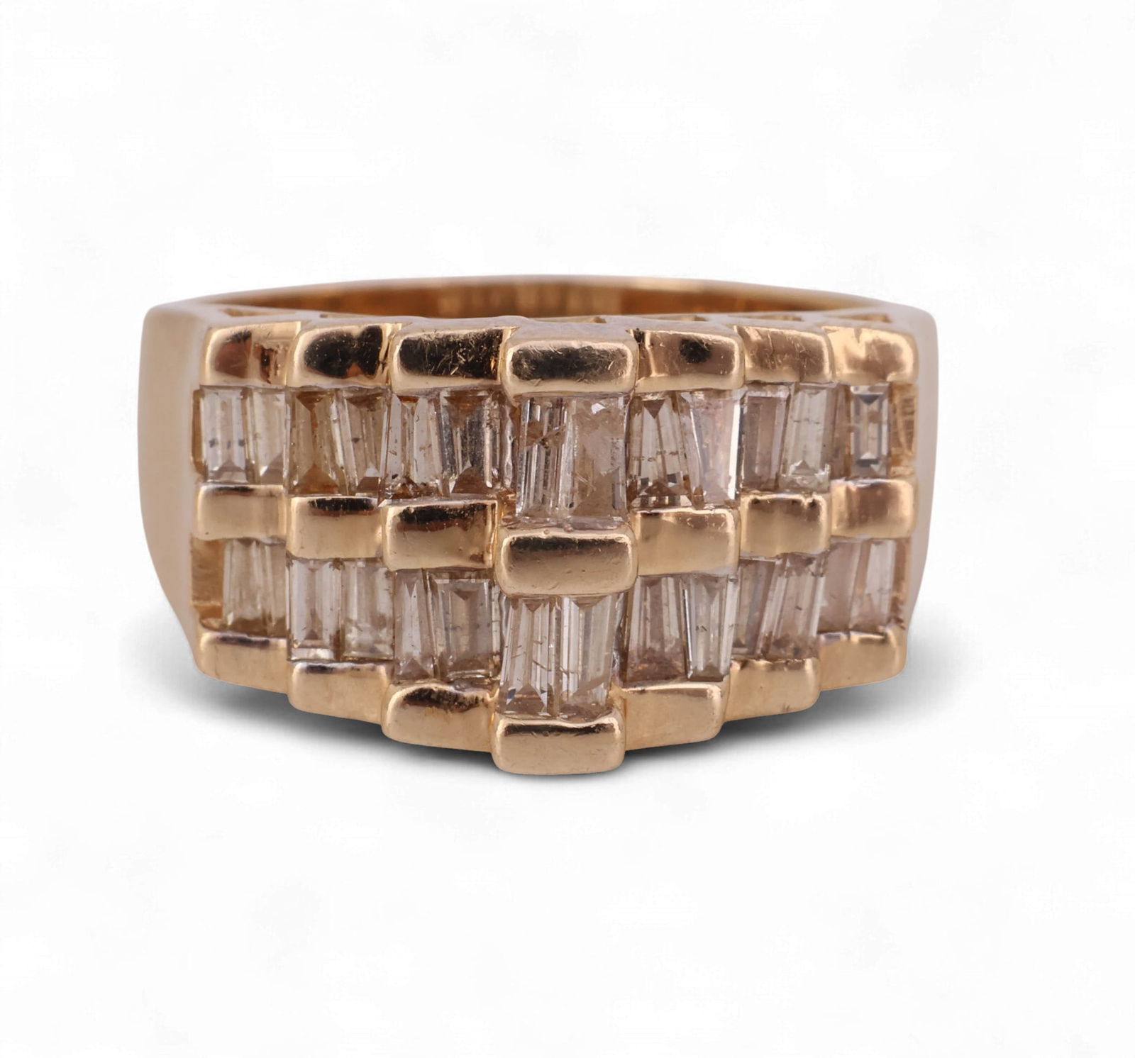 14k Gold 1 CT TW Baguette Diamond Anniversary Ring: Diamond anniversary-style cocktail ring crafted in 14k gold. The design is accented with twenty-eight channel-set baguette-cut diamonds totaling approximately 1.00 carat, judged to be J-K color and SI