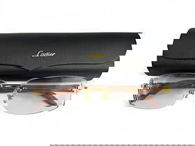 Cartier French Designer Eyeglass Sunglass Frames: Pair of Cartier France luxury designer rimless eyewear featuring gold-tone hardware and wood-grain temples. The frames are signed Cartier and include a black Cartier hard case with a gold logo. Glasse